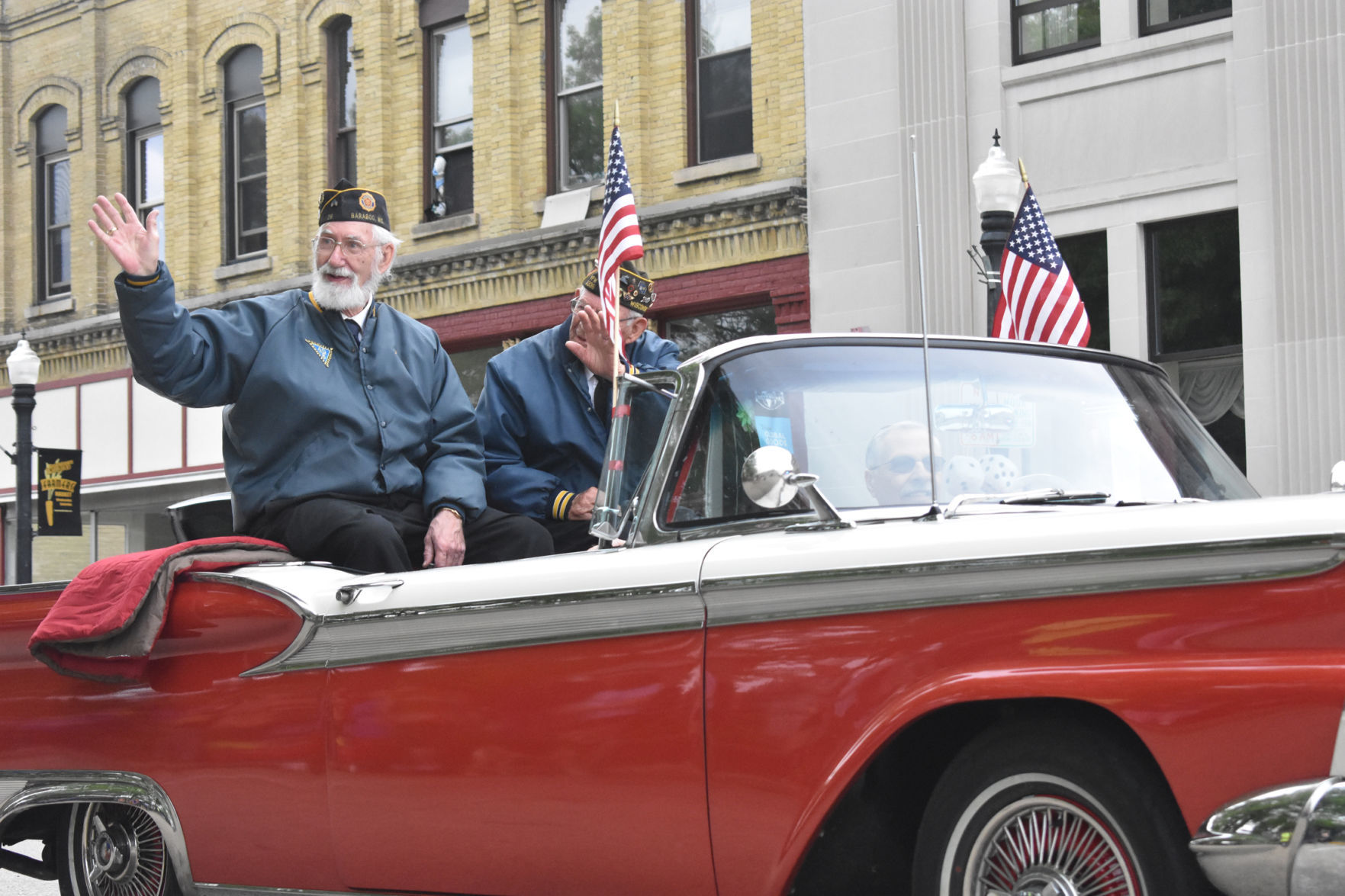 Veterans wave to crowd during Baraboo parade